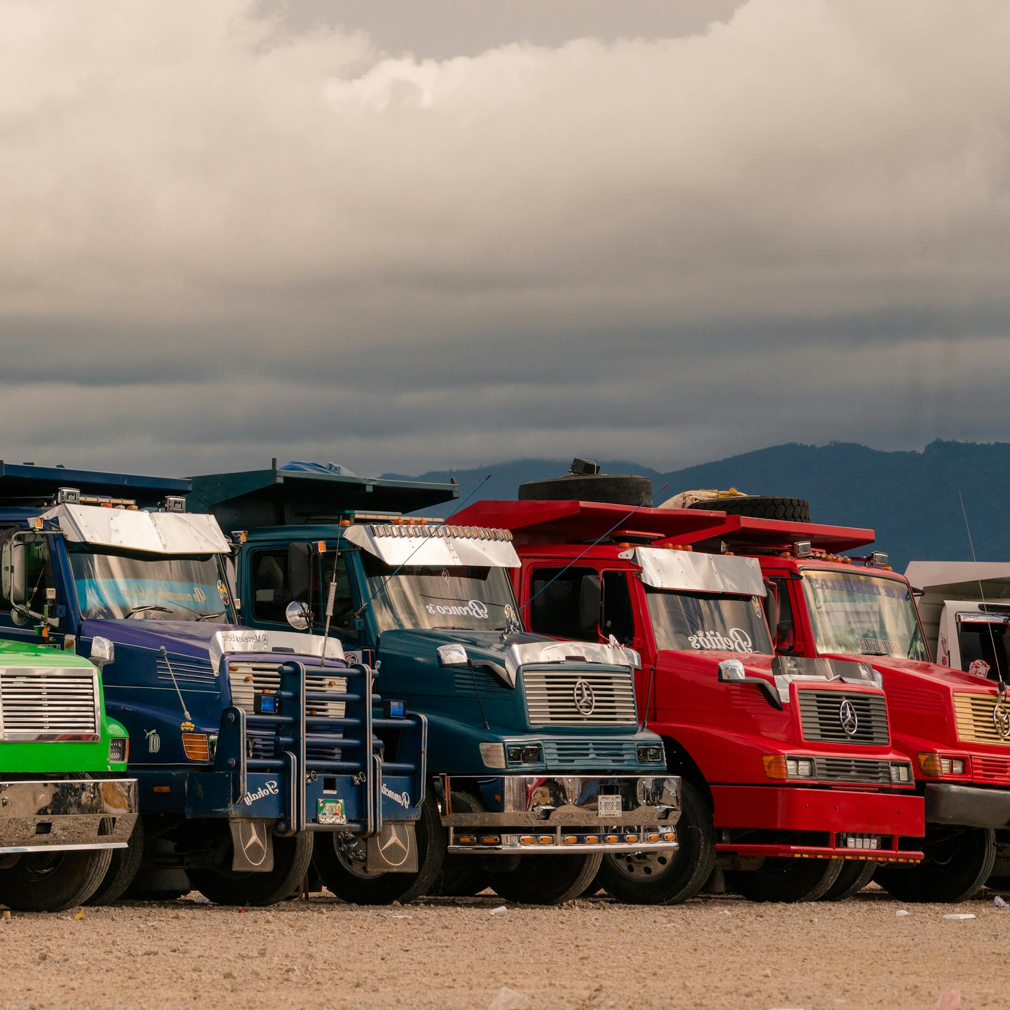 Photo of Trucks in a Row on a Car Park